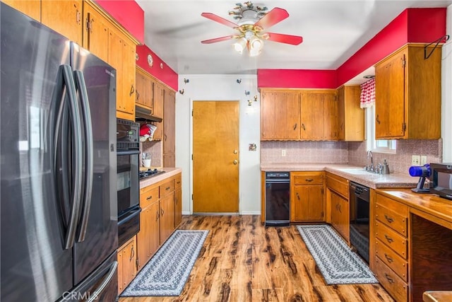 217 Syllmar Cir, Calimesa, CA 92320 - kitchen with black appliances, a sink, ceiling fan, tasteful backsplash, and light countertops