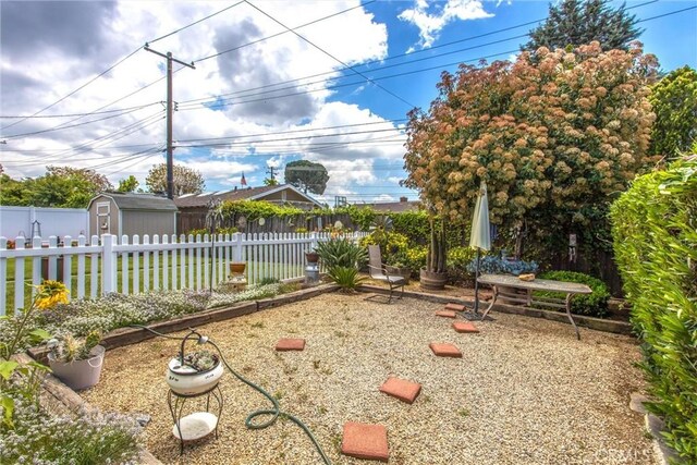 217 Syllmar Cir, Calimesa, CA 92320 - view of yard with a shed, fence, and an outdoor structure