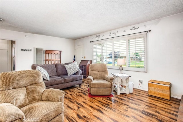 217 Syllmar Cir, Calimesa, CA 92320 - living area featuring a textured ceiling and wood finished floors
