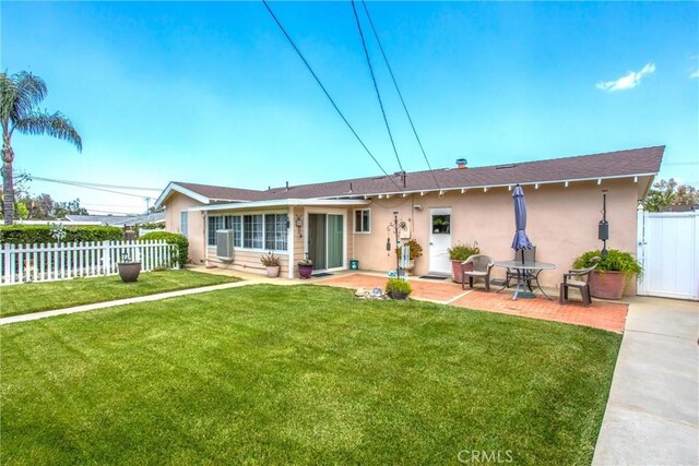 217 Syllmar Cir, Calimesa, CA 92320 - back of property with stucco siding and a patio area