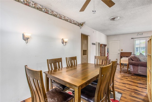 217 Syllmar Cir, Calimesa, CA 92320 - dining area with a textured ceiling, wood finished floors, and ceiling fan