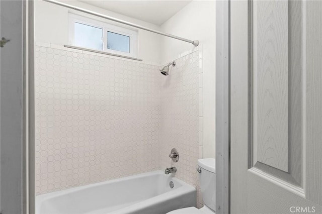 bathroom with toilet and shower / washtub combination