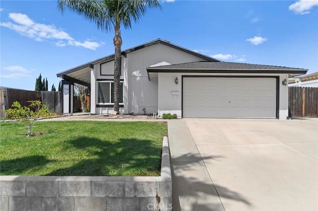 view of front of home featuring concrete driveway and an attached garage