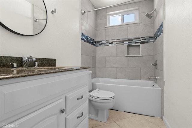 bathroom featuring tub / shower combination, tile patterned floors, toilet, and vanity