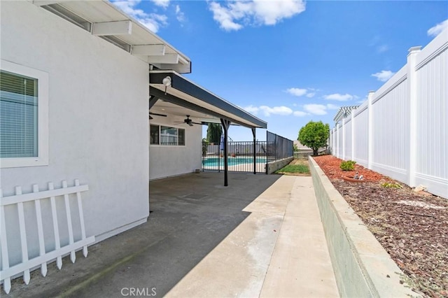 view of patio / terrace with a ceiling fan and a fenced backyard