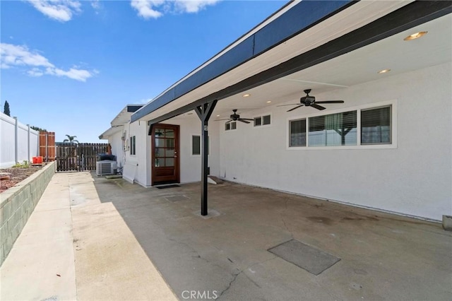view of patio with a ceiling fan and fence
