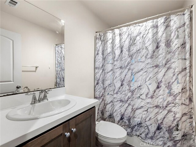 10630 Appaloosa Ave, Hesperia, CA 92345 - full bath featuring vanity, toilet, and a shower with shower curtain