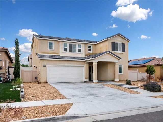 10630 Appaloosa Ave, Hesperia, CA 92345 - traditional-style home featuring an attached garage, stucco siding, concrete driveway, and fence