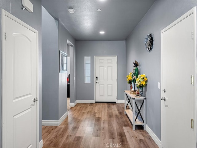 10630 Appaloosa Ave, Hesperia, CA 92345 - entryway with wood finished floors, baseboards, and recessed lighting