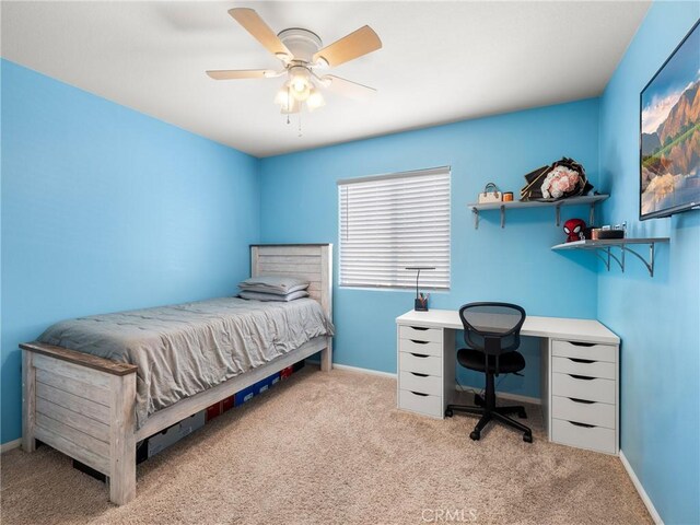 10630 Appaloosa Ave, Hesperia, CA 92345 - carpeted bedroom with baseboards and a ceiling fan