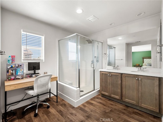 10630 Appaloosa Ave, Hesperia, CA 92345 - bathroom featuring wood finished floors, a stall shower, double vanity, and recessed lighting