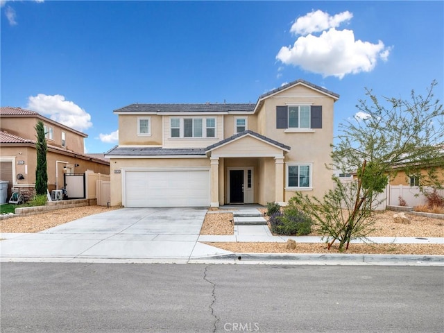 10630 Appaloosa Ave, Hesperia, CA 92345 - view of front of home featuring stucco siding, fence, a garage, and concrete driveway