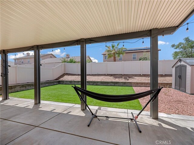 10630 Appaloosa Ave, Hesperia, CA 92345 - view of patio with a shed and an outbuilding