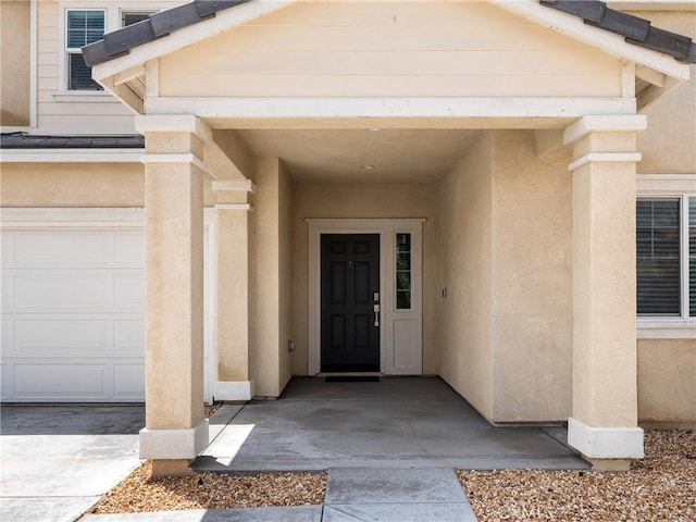 10630 Appaloosa Ave, Hesperia, CA 92345 - property entrance with stucco siding and a garage
