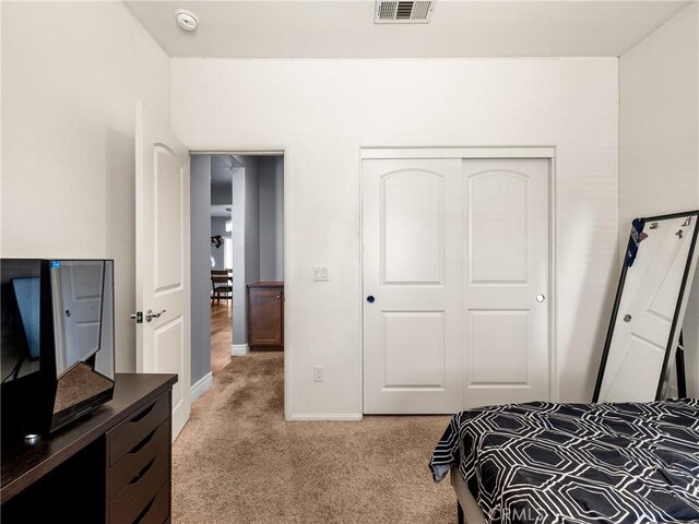 10630 Appaloosa Ave, Hesperia, CA 92345 - bedroom with light colored carpet, baseboards, and a closet