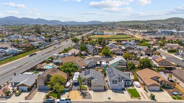 aerial perspective of suburban area with a mountainous background