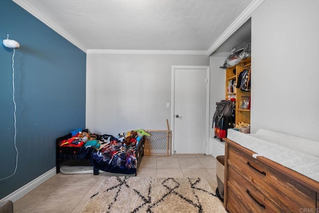 tiled bedroom with ornamental molding and baseboards