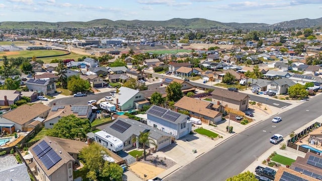 aerial perspective of suburban area with a mountainous background