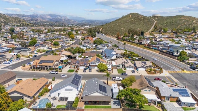 aerial perspective of suburban area with a mountainous background