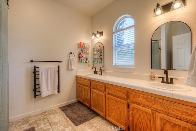 1918 Potter Rd, Chico, CA 95928 - bathroom with double vanity and baseboards