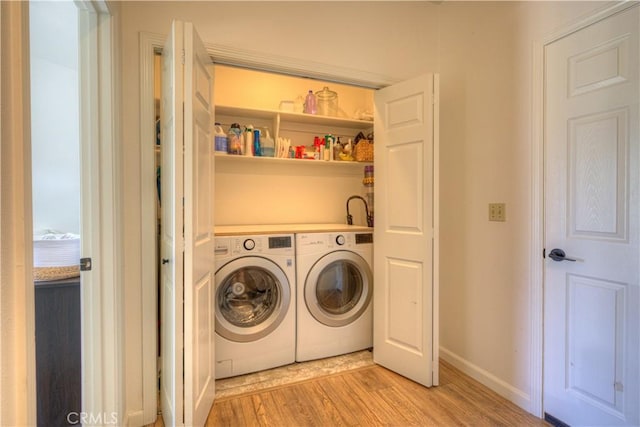 1918 Potter Rd, Chico, CA 95928 - laundry room featuring washer and dryer, light wood-style flooring, and baseboards