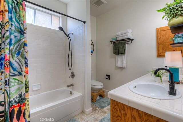 1918 Potter Rd, Chico, CA 95928 - bathroom with toilet, shower / tub combo with curtain, baseboards, and vanity