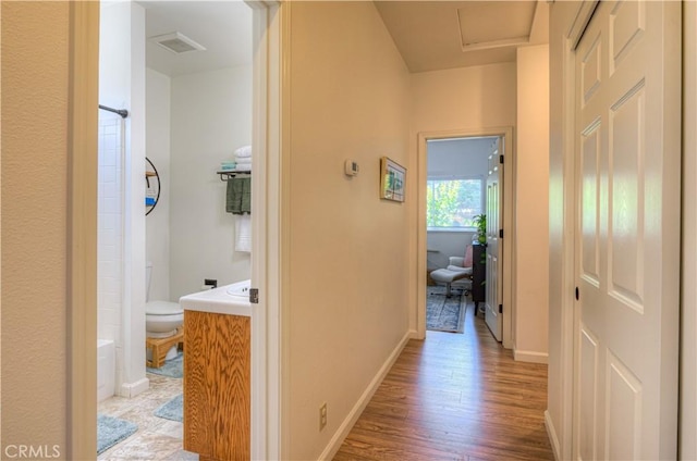 1918 Potter Rd, Chico, CA 95928 - hall featuring light wood-type flooring, baseboards, and attic access