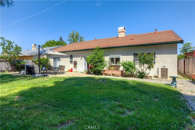 1918 Potter Rd, Chico, CA 95928 - rear view of property with a tiled roof, a chimney, central AC, stucco siding, and a patio