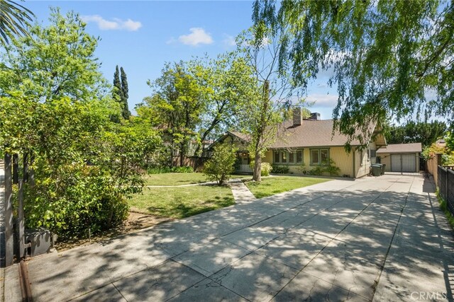 1156 E Howard St, Pasadena, CA 91104 - view of front facade with driveway and a chimney
