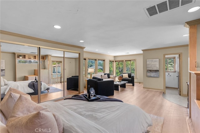 1156 E Howard St, Pasadena, CA 91104 - bedroom with crown molding, recessed lighting, a closet, light wood-type flooring, and baseboards