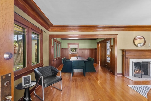 1156 E Howard St, Pasadena, CA 91104 - dining space featuring wood finished floors, crown molding, a fireplace, wainscoting, and wooden walls