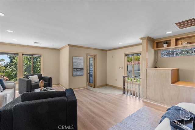 1156 E Howard St, Pasadena, CA 91104 - living area featuring light wood finished floors, healthy amount of natural light, recessed lighting, baseboards, and crown molding