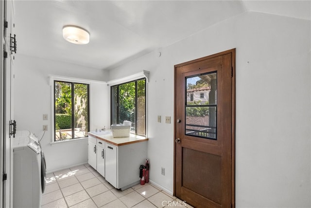 1156 E Howard St, Pasadena, CA 91104 - clothes washing area featuring a sink, light tile patterned floors, and baseboards