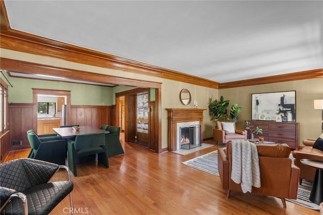 1156 E Howard St, Pasadena, CA 91104 - living room with a high end fireplace, light wood-style flooring, a wainscoted wall, and ornamental molding