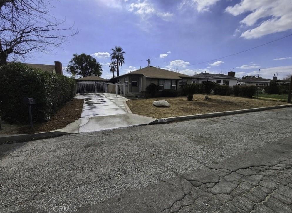 25573 18th St, San Bernardino, CA 92404 - ranch-style house featuring concrete driveway and fence