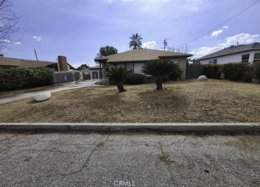 25573 18th St, San Bernardino, CA 92404 - view of front of home with fence