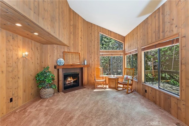 27657 Peninsula Dr, Lake Arrowhead, CA 92352 - sitting room with carpet flooring, wooden walls, plenty of natural light, and a fireplace