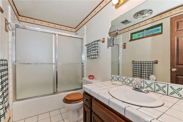27657 Peninsula Dr, Lake Arrowhead, CA 92352 - bathroom featuring enclosed tub / shower combo, toilet, tile patterned floors, and vanity
