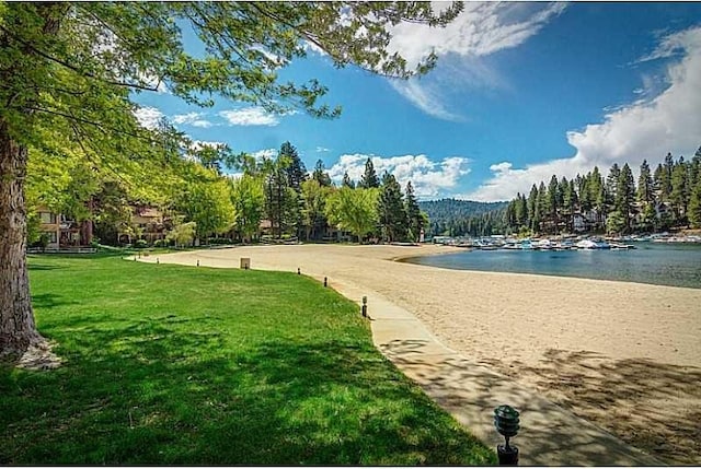 27657 Peninsula Dr, Lake Arrowhead, CA 92352 - view of community with a water view and a yard