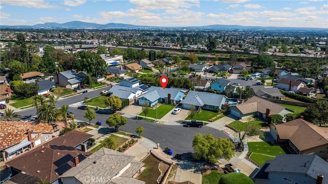 view of property location featuring nearby suburban area and a mountainous background