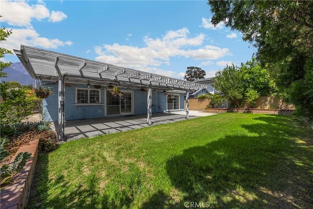back of property featuring a pergola, a patio, and ceiling fan