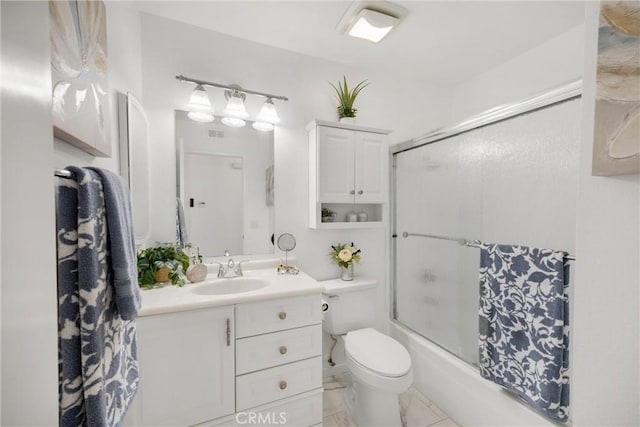 full bath featuring vanity, combined bath / shower with glass door, and toilet
