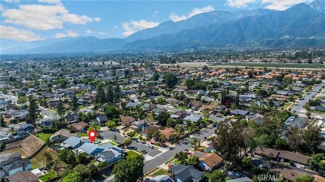 view of property location with a mountainous background and nearby suburban area