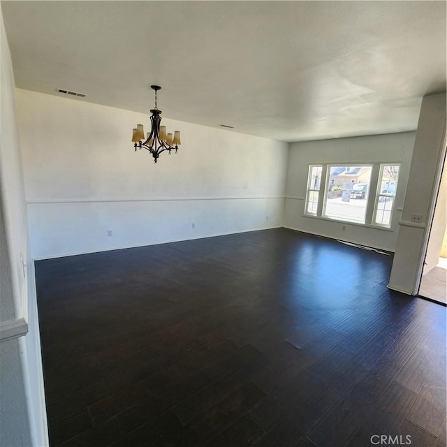 4542 Kalpesh Ct, Hemet, CA 92544 - empty room featuring a chandelier and dark wood-type flooring