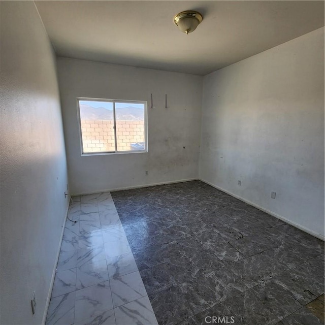 4542 Kalpesh Ct, Hemet, CA 92544 - unfurnished room featuring baseboards and marble look tiles