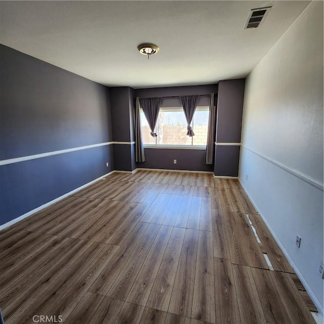 4542 Kalpesh Ct, Hemet, CA 92544 - empty room with wood finished floors and baseboards