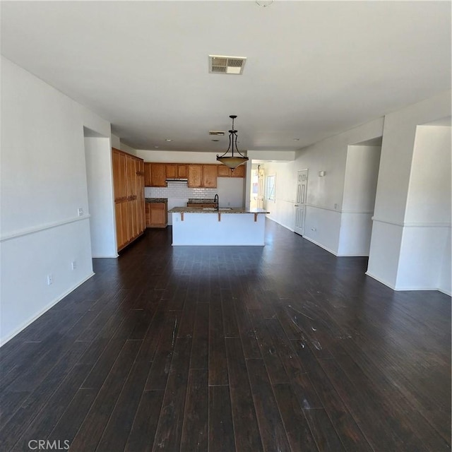 4542 Kalpesh Ct, Hemet, CA 92544 - unfurnished living room featuring dark wood finished floors, baseboards, and a sink