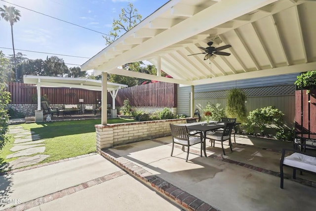 view of patio / terrace with ceiling fan, outdoor dining area, and a gazebo