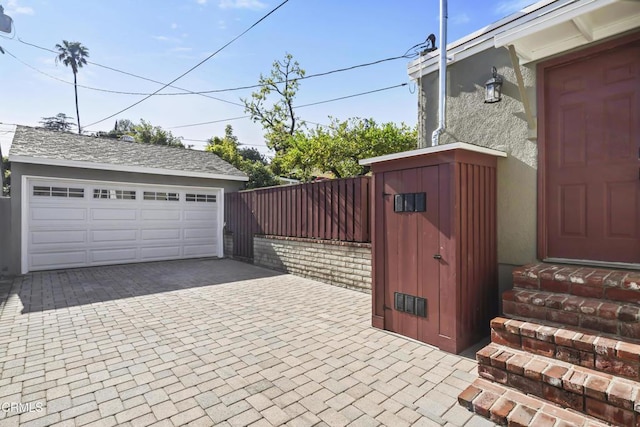 detached garage with fence