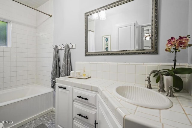 bathroom featuring vanity and shower / tub combo with curtain